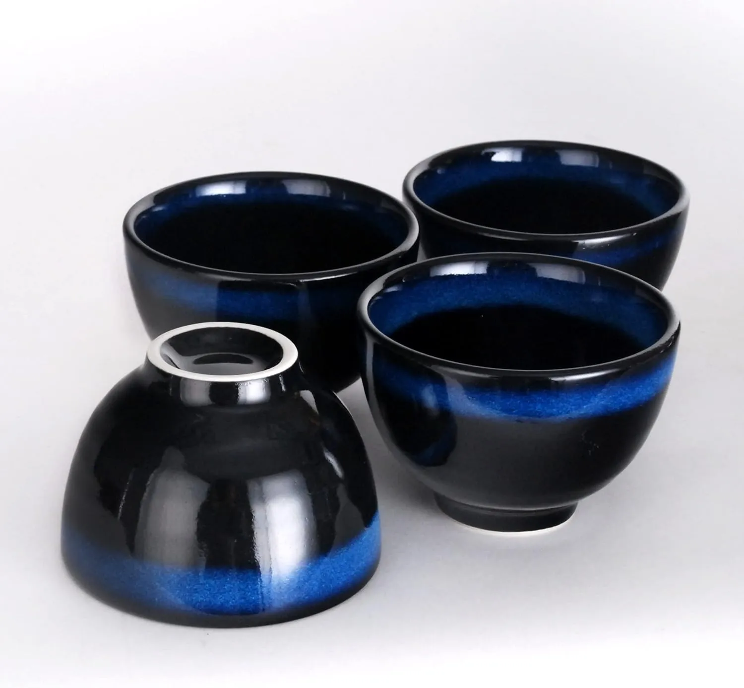 Hinomaru Collection Kagetsu Reactive Glazed Porcelain Japanese Style Tea Set 24 fl oz Teapot with Rattan Handle and Four Tea Cups (Black/Blue)